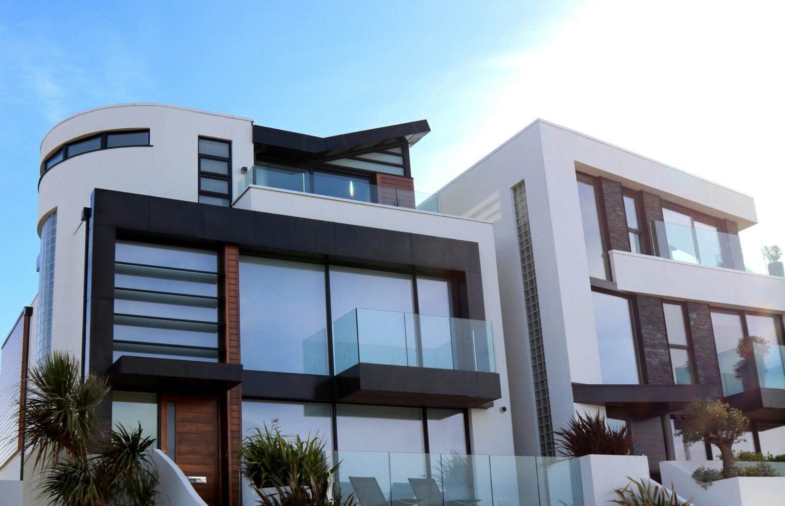 Certificate in Property Management 1 Contemporary luxury home with glass balconies in Poole, UK, showcasing modern architectural design.